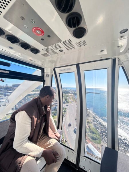 Brandon Mlilo on the Cape Wheel exploring free things to do on your birthday in Cape Town