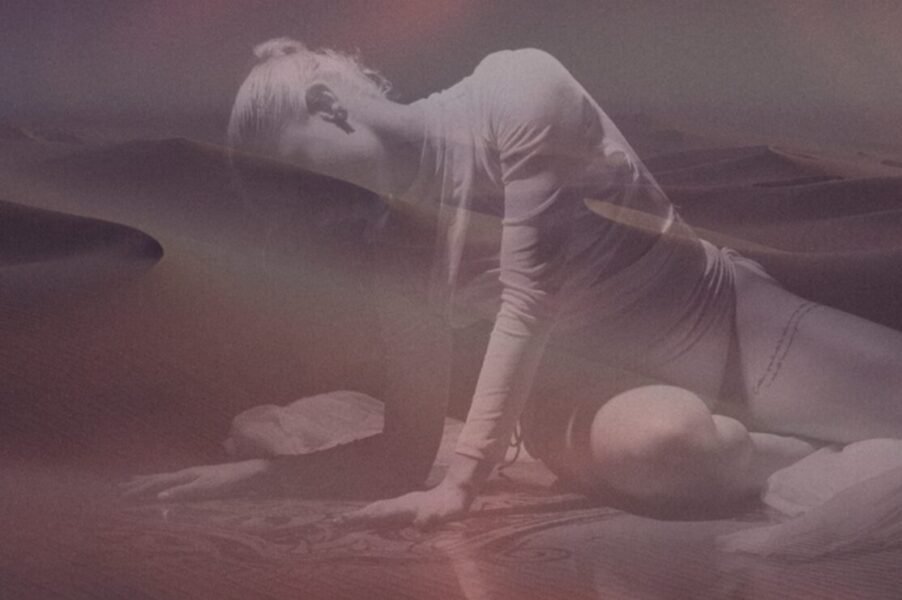 Woman on floor imposed over faint desert vista, poster image for performance art event in Cape Town this July.
