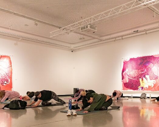 People doing pilates in an exhibit at Norval Foundation, as in event advertised in Cape Town this July.